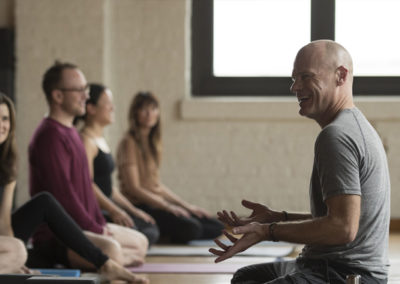 A Yoga Teacher Teaching a Class in Progress